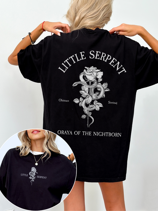 Back view of a black Bella Canvas t-shirt with gothic arched text reading Little Serpent above a detailed illustration of a snake wrapped around a blooming rose, with the words Obitraes and Sivrinaj on either side and Oraya of the Nightborn at the bottom; front inset shows matching design centered on the chest.