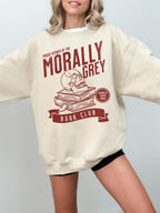 woman wearing sand sweatshirt with red morally grey book club graphic and enemies to lovers motif