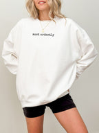 woman wearing white sweatshirt with black most ardently quote from Pride and Prejudice