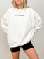 woman wearing white sweatshirt with black most ardently quote from Pride and Prejudice