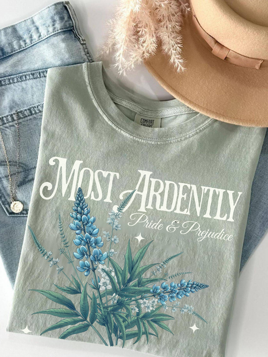 flat lay of sage green Most Ardently t-shirt with romantic blue flower illustration and Jane Austen text