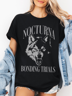 black oversized t shirt with Nocturna Bonding Trials wolf graphic styled with denim jacket and shorts