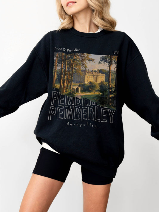 woman wearing black crewneck sweatshirt with Pemberley illustration from Pride and Prejudice and 1813 date