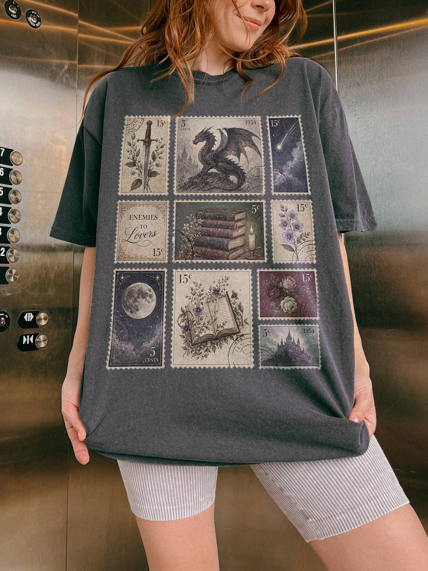 Woman wearing pepper fantasy book lover t shirt with vintage postage stamp artwork featuring dragon celestial moon books flowers and gothic castle aesthetic