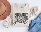 sand Probably Reading Smut sweatshirt with rolled sleeves styled with jeans and felt hat
