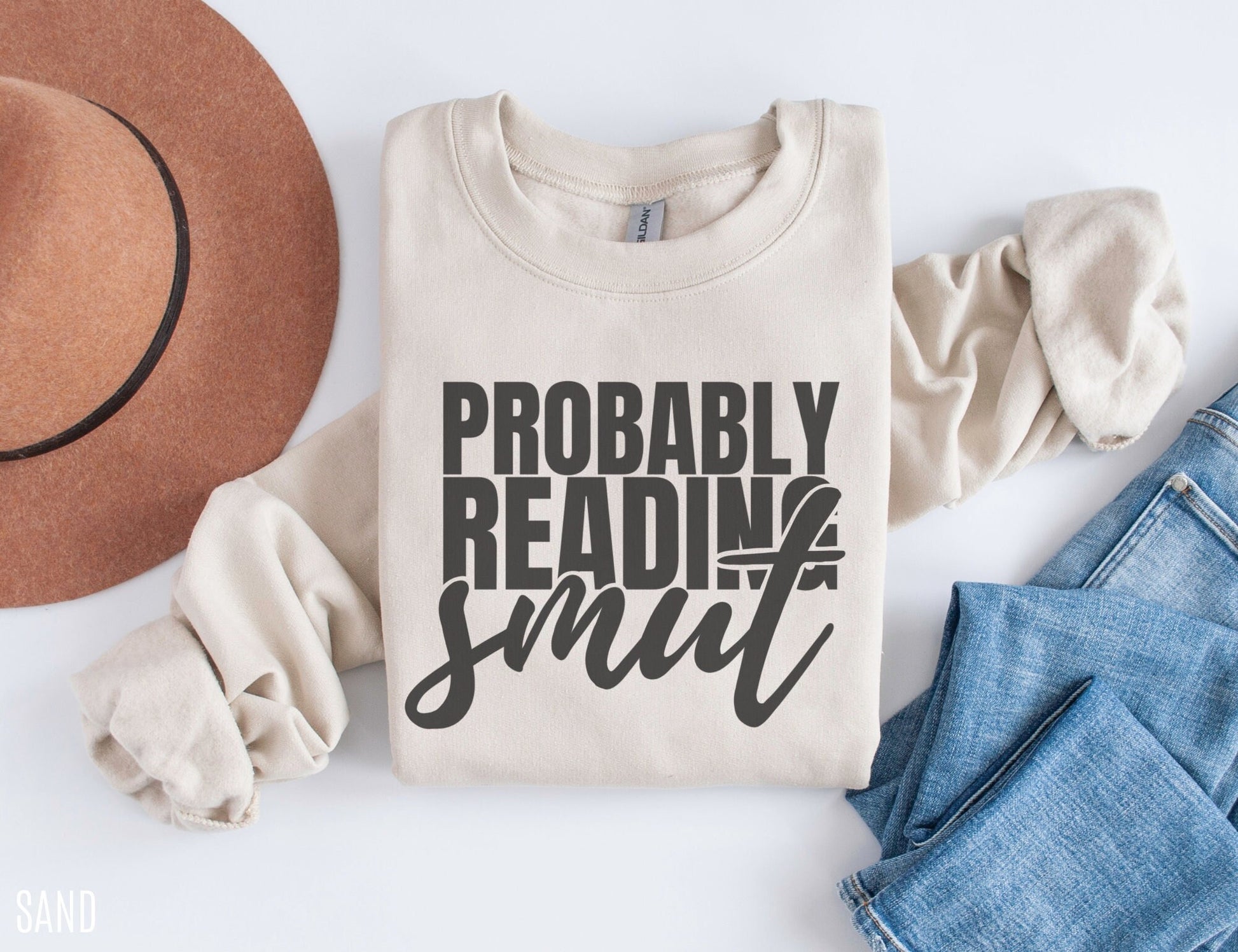 sand Probably Reading Smut sweatshirt with rolled sleeves styled with jeans and felt hat