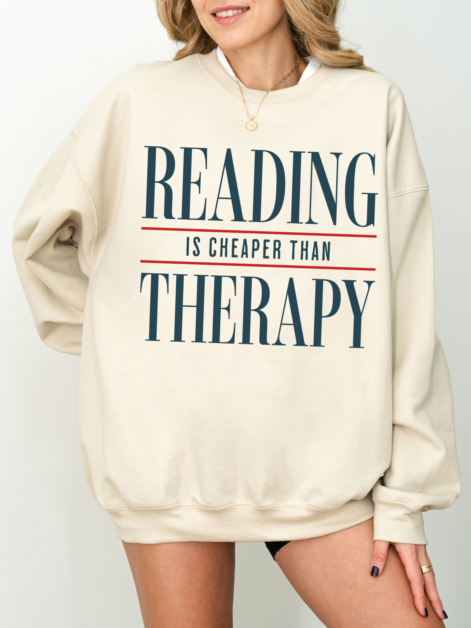 sand beige book lover sweatshirt with reading is cheaper than therapy quote in minimalist typography style oversized crewneck