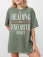 woman wearing moss reading is my favorite sport comfort colors t shirt with oversized fit and casual everyday styling