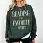 woman standing in forest green sweatshirt with large text reading is my favorite sport in white and red