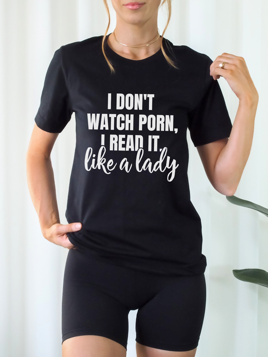 woman wearing black fitted t-shirt that says i don't watch porn i read it like a lady with biker shorts