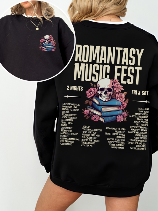 Black sweatshirt with small skull and book stack graphic on the front left chest and full Romantasy Music Fest print on the back, featuring a bold fantasy reader lineup and styled with relaxed hair and minimal jewelry.
