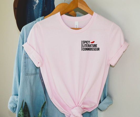 pastel pink spicy literature connoisseur shirt hanging on wood hanger with chambray jacket