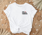 white t-shirt tied at the waist with spicy literature connoisseur design laid on woven boho rug