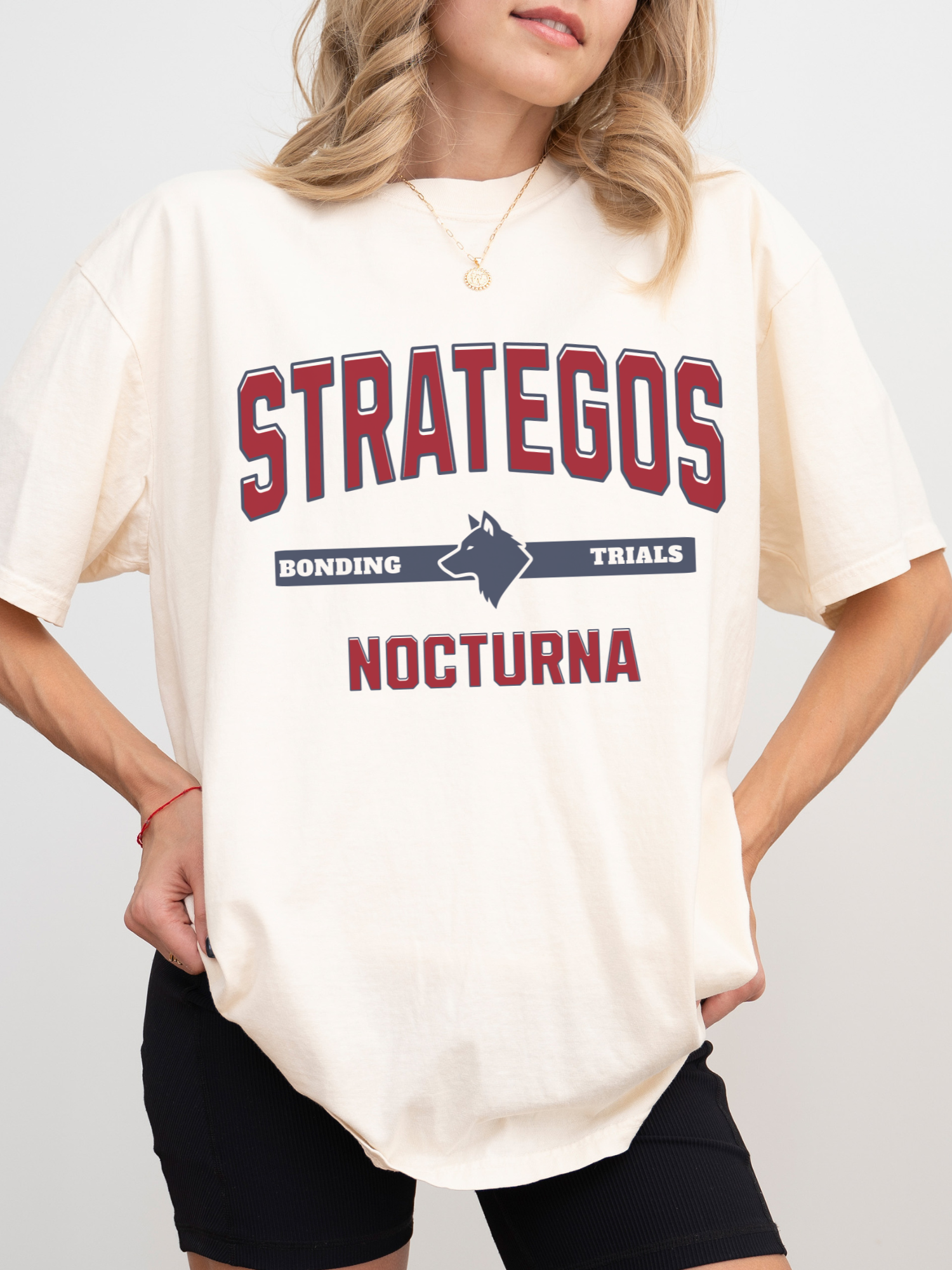 ivory comfort colors t shirt with Strategos Nocturna bonding trials wolf mascot romantasy inspired design