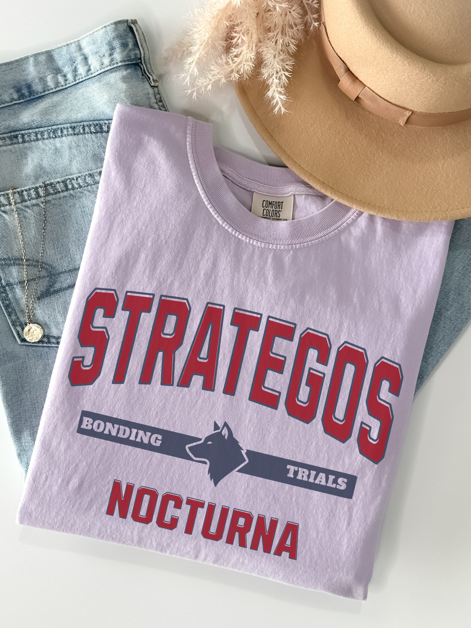 orchid comfort colors t shirt flat lay with Strategos Nocturna bonding trials wolf fantasy graphic