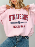 light pink gildan sweatshirt with Strategos Nocturna fantasy academy inspired bonding trials design