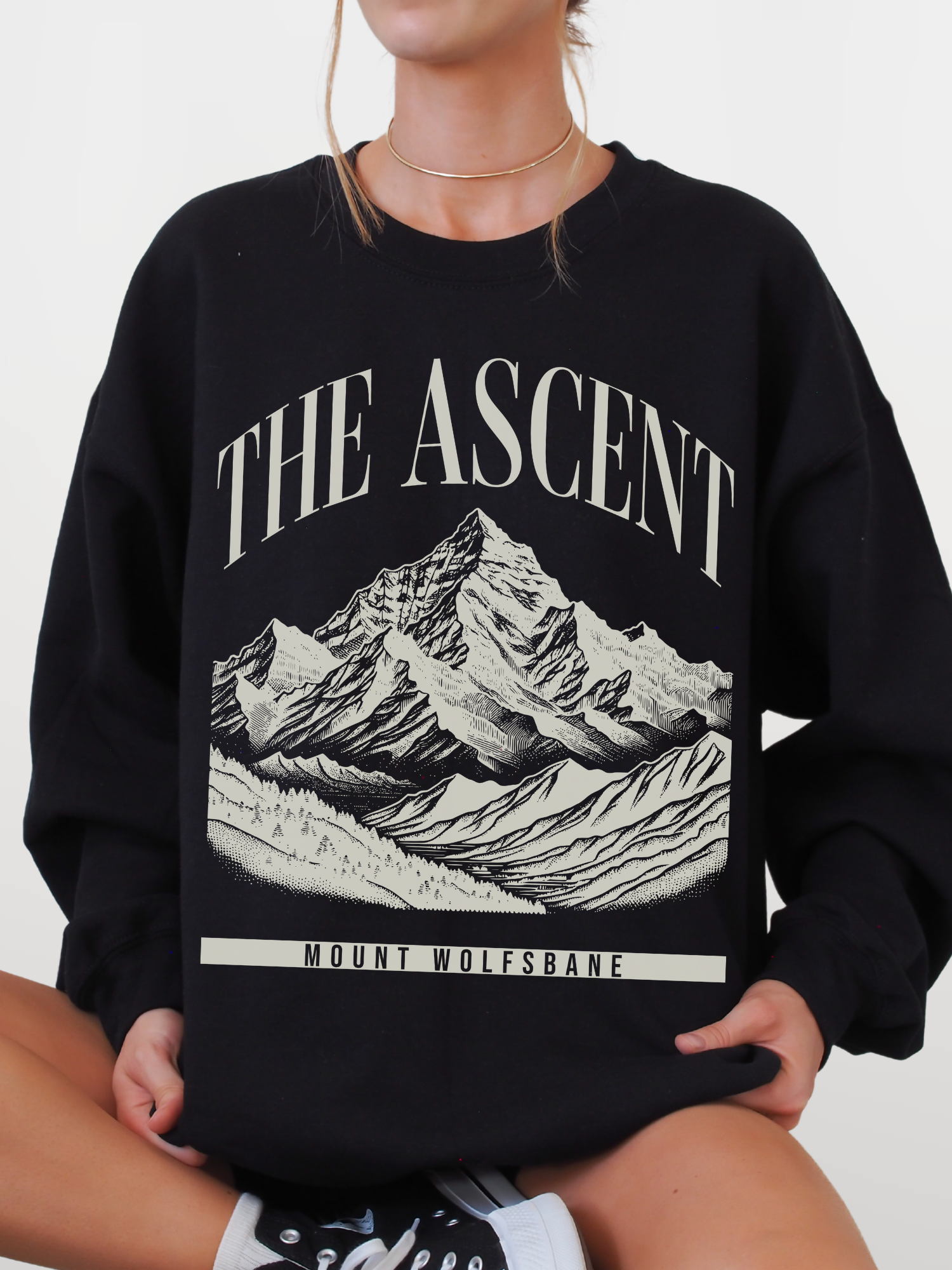 black crewneck sweatshirt featuring The Ascent Mount Wolfsbane mountain graphic design inspired by fantasy adventure books