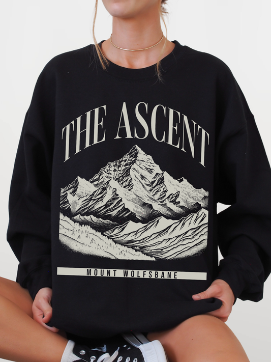 black crewneck sweatshirt featuring The Ascent Mount Wolfsbane mountain graphic design inspired by fantasy adventure books