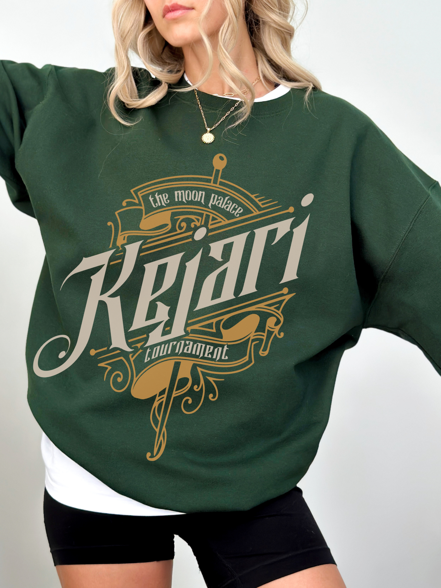 Forest green Kejari Tournament crewneck sweatshirt with gold detailing and sword motif, ideal for fantasy book fans and cozy cold-weather layering.