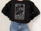 black crewneck sweatshirt with minimalist white tarot card design and The Writer caption