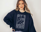 woman in navy fantasy writer sweatshirt with magical tarot card illustration and floral border