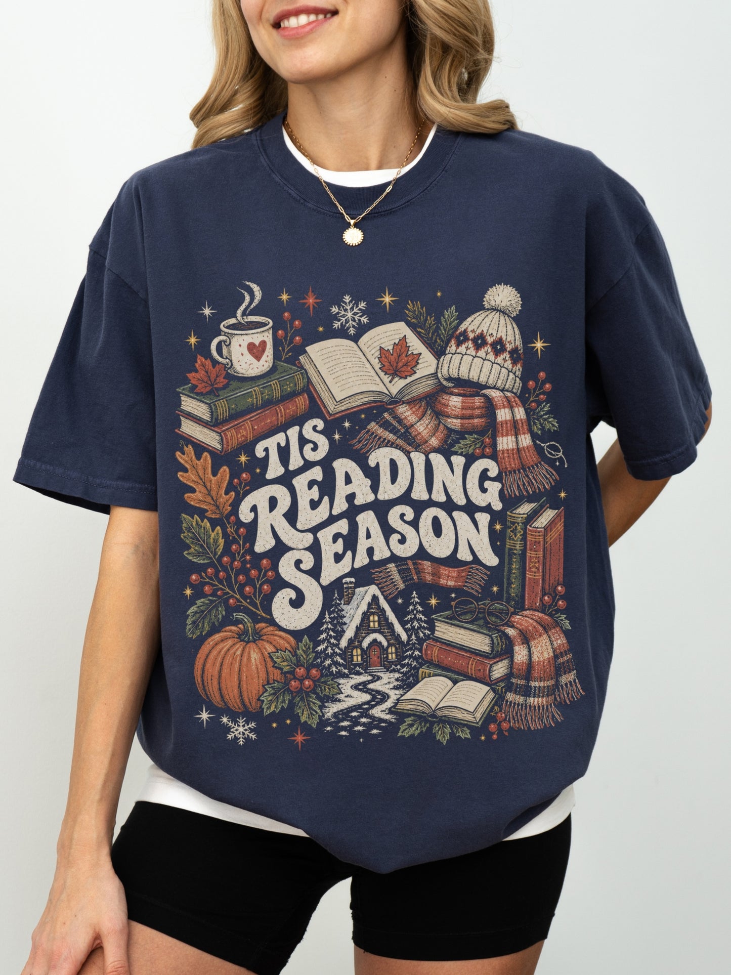 Navy Comfort Colors shirt featuring a cozy Tis Reading Season design with stacked books, open book, coffee, autumn leaves, pumpkin, scarf, knit hat and winter cottage, book lover gift for readers