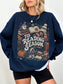Navy Gildan sweatshirt modeled with a Tis Reading Season design featuring stacked books, open book, coffee mug, autumn leaves, pumpkin, scarf and snowy cottage, cozy reading sweatshirt for book lovers