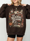 Dark Chocolate Gildan sweatshirt featuring a vintage Tis Reading Season graphic with books, coffee, pumpkin, fall leaves, scarf, winter hat and cozy cottage, book lover sweatshirt for readers