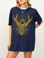Close-up of a woman wearing a navy Terrasen shirt with gold fantasy design featuring antlers and stars

