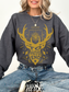 woman in dark heather grey sweatshirt with gold fantasy design and “To Whatever End” quote from the Throne of Glass series

