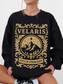 woman in a black sweatshirt with bold gold Velaris City of Starlight fantasy crest design