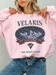 woman wearing a pink vintage velaris sweatshirt with night court inspired mountain illustration