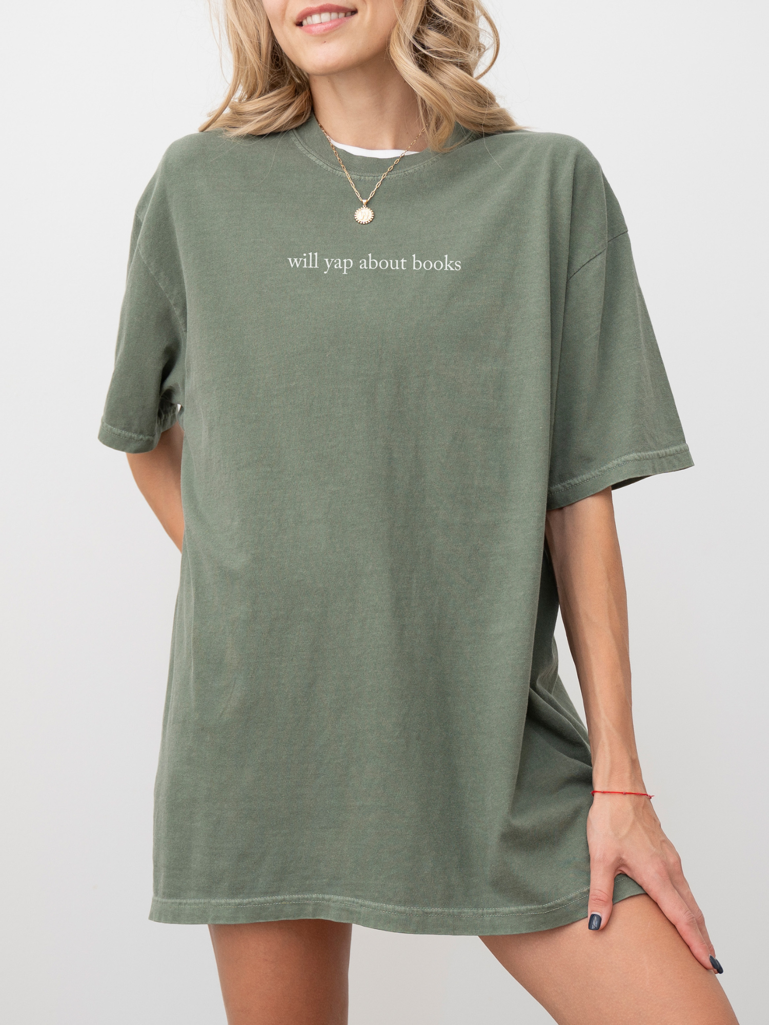 woman wearing a moss green t-shirt with the words will yap about books in small minimalist font